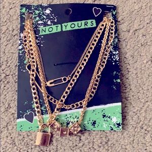 NWT set of four gold tone necklaces